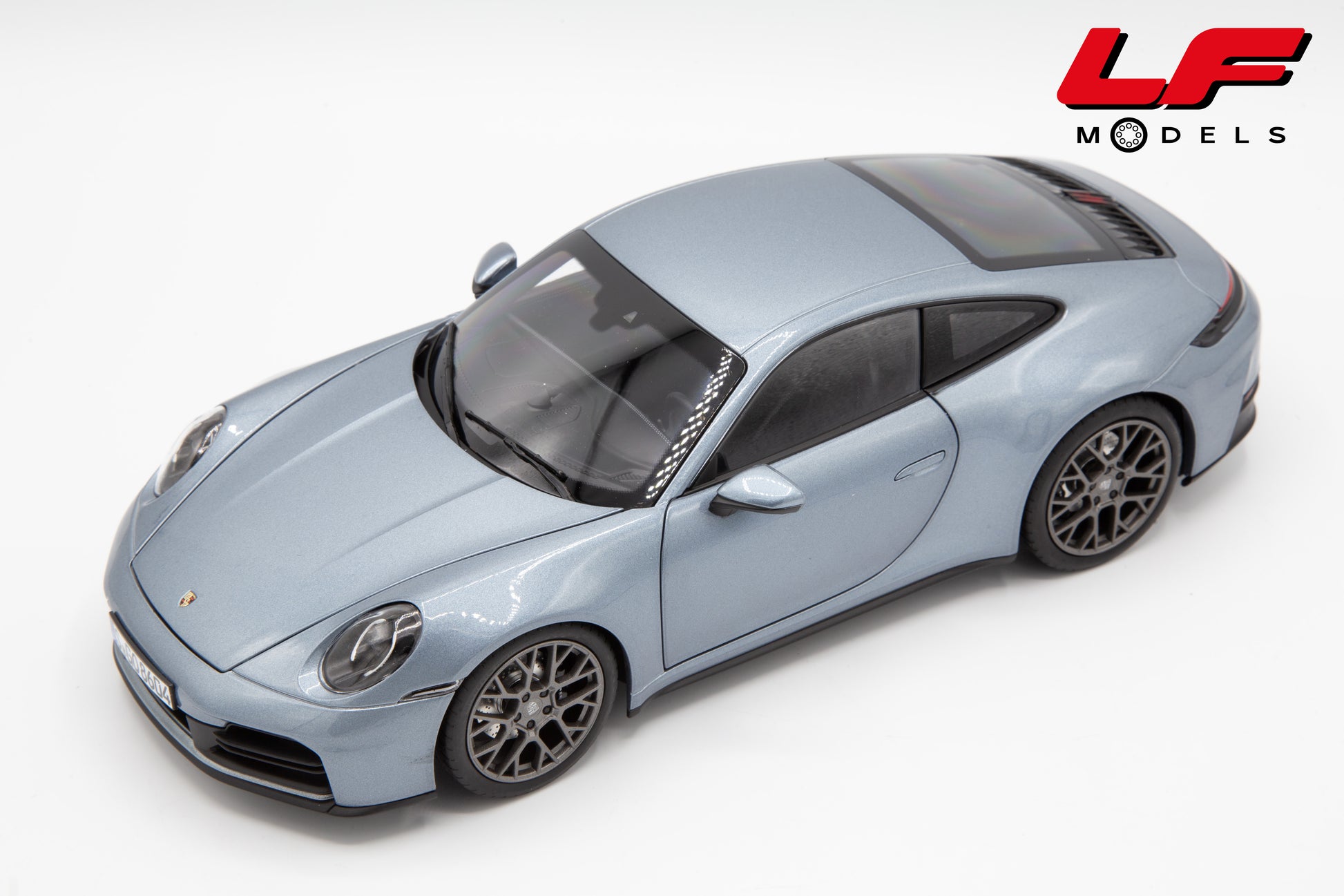 modellino porsche 911 992 norev 1:18 alto